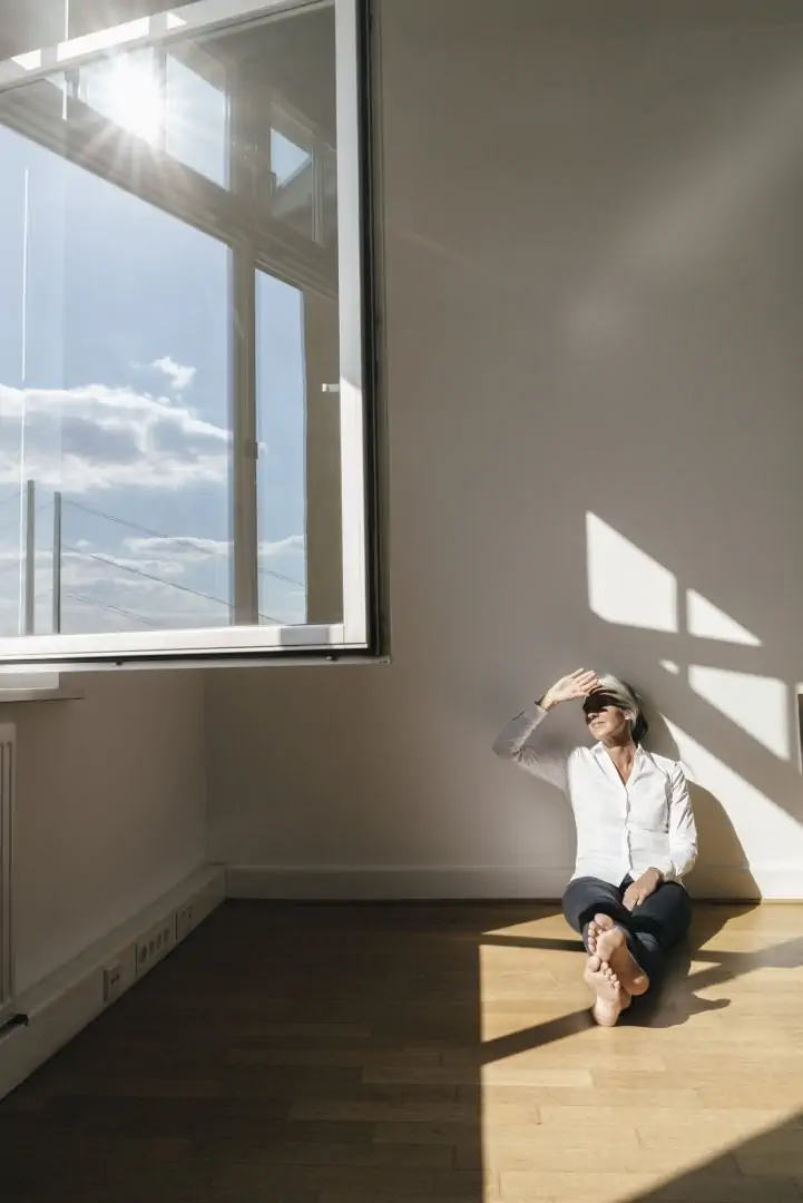 Businesswoman Sitting On Floor In Office